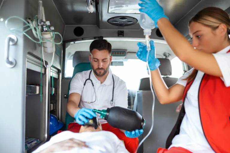 view-from-inside-ambulance-uniformed-emergency-services-workers-caring-patient-stretcher-coronavirus-pandemic